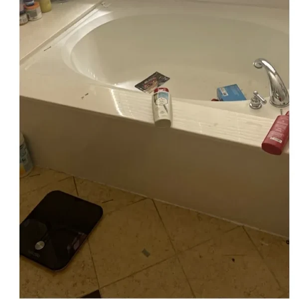 Untidy bathtub before cleaning
