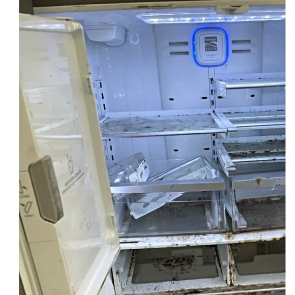 Dirty refrigerator interior before cleaning
