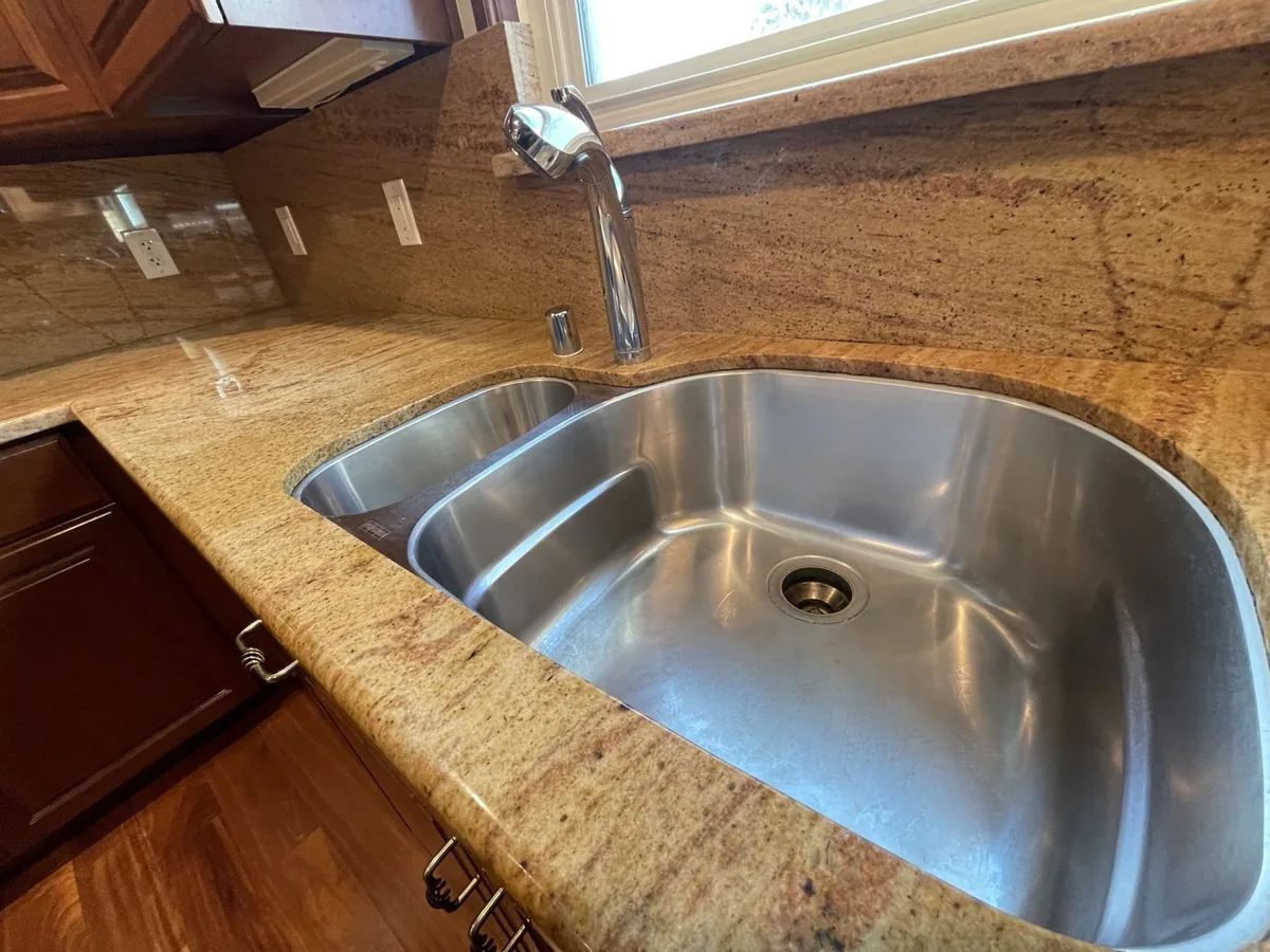 Sparkling clean kitchen sink after a deep cleaning