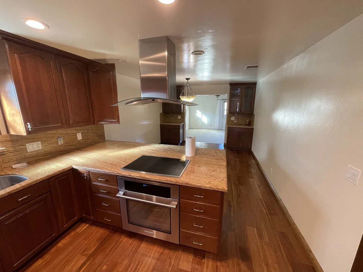 Gleaming wood kitchen floor after vacation rental turnover clean